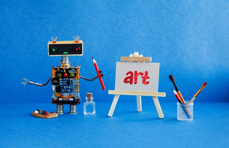 Art and robotic artificial intelligence concept. Robot artist, wooden easel and the handwritten word Art painted red watercolor.